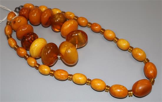 A single strand graduated oval amber bead necklace with spacers and an amber bead bracelet, gross weight 130 grams, necklace 46cm.